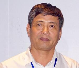 Image of an Asian man in a white button down shirt